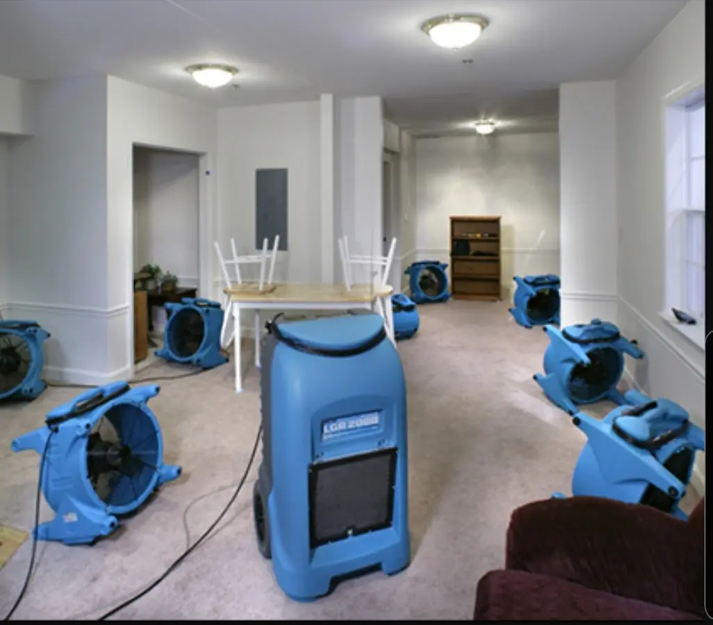 Air movers and dehumidifier setup for Water Damage Restoration in Monticello
